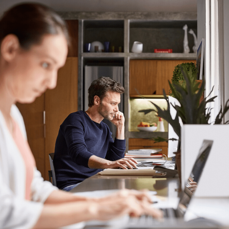 Man and woman working from their home office